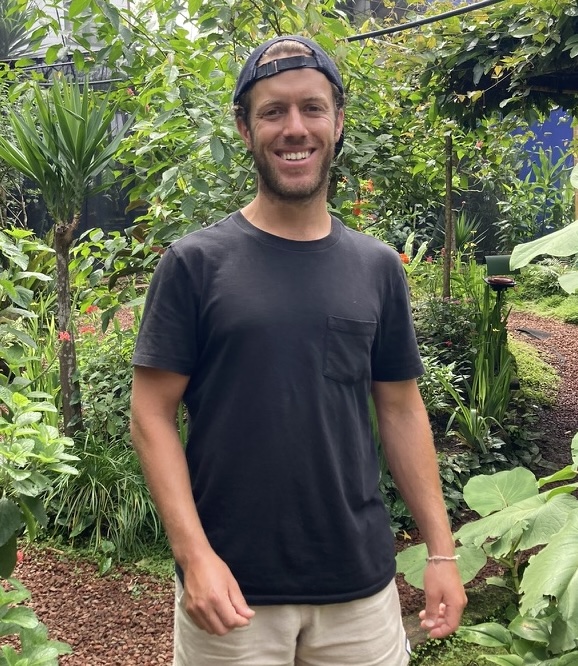 Robin Shindelman with his back to the jungle.